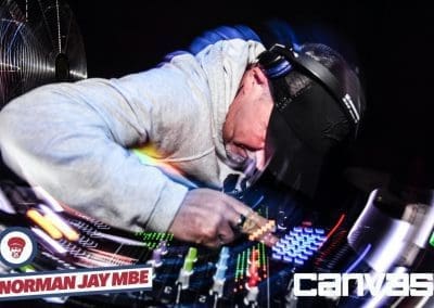 DJ playing on the decks at the Norman Jay night at Canvas Bournemouth