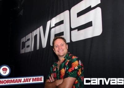 Guest posing by the Canvas sign at the Norman Jay night at Canvas Bournemouth