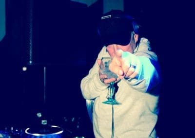 Performer under blue stage lights at the Norman Jay night at Canvas Bournemouth