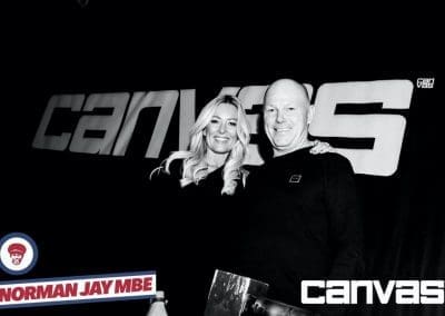 Guest posing by the Canvas sign at the Norman Jay night at Canvas Bournemouth