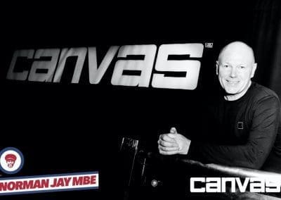 Guest posing by the Canvas sign at the Norman Jay night at Canvas Bournemouth