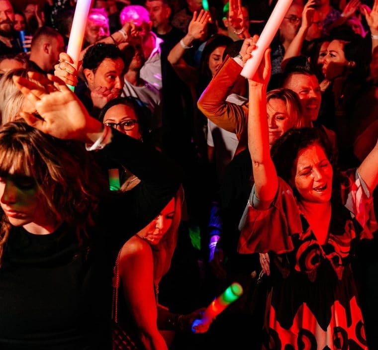 Crowd with glow sticks celebrating at a club night at Canvas Bournemouth